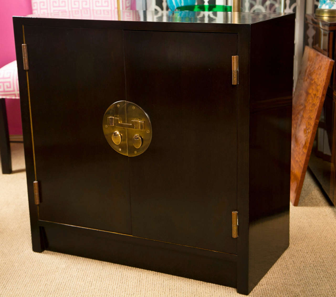 Classic two door Dunbar chest with brass Asian style hardware.
Deep chocolate finish.