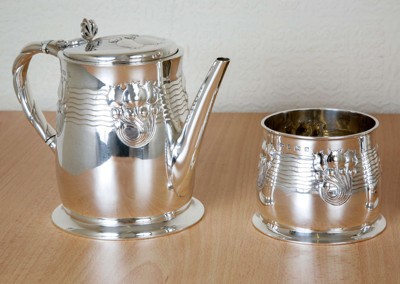 Art Nouveau Sterling Silver Tea and Coffee Service. This extremely unusual 4-piece set is of a wonderful design rarely seen in silver, and depicting poppy bulbs embossed on an otherwise plain surface.
The height of the coffee pot is 20.4cms; and