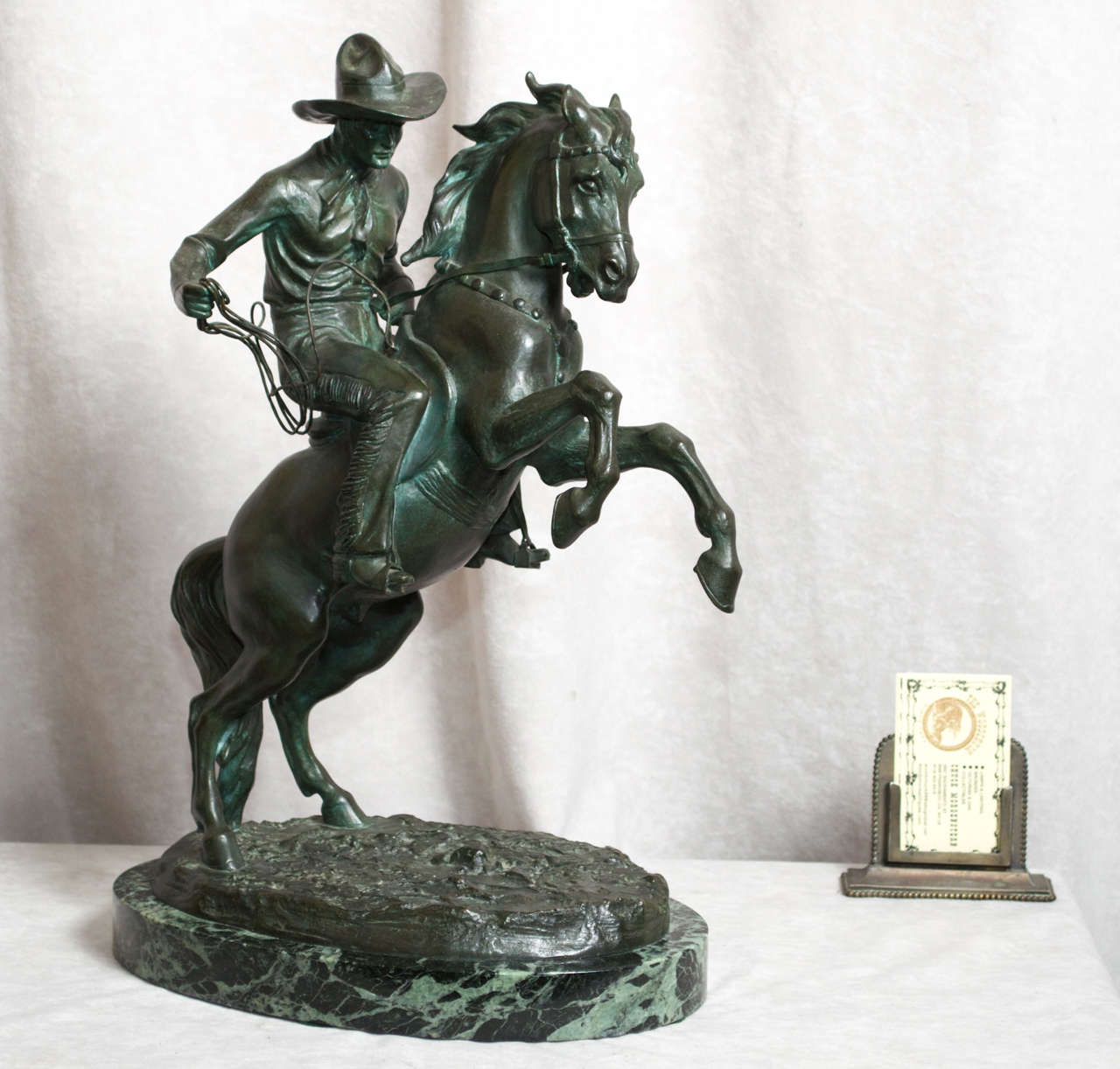 This finely detailed and high action bronze of a cowboy is signed by the noted Austrian artist TH Ullmann.  We believe this is an example of Tom Mix, the famous American cowboy of the silent movie era.  We also have a statue of Lindberg by Ullmann. 