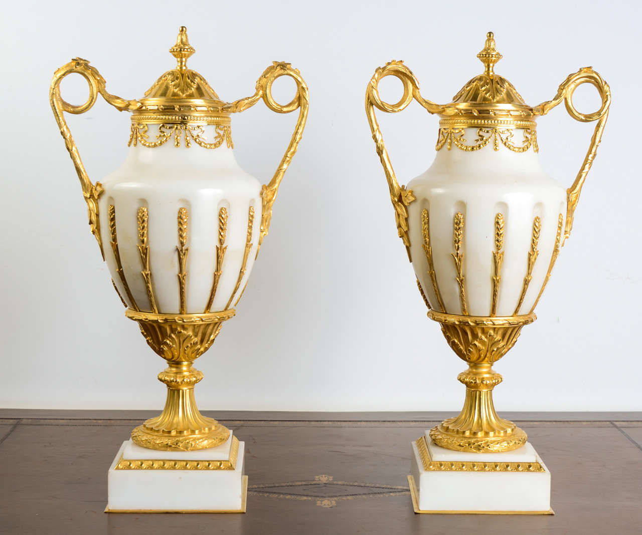 pair of urns, white onyx ornemented with gilded bronze very finely chizeled