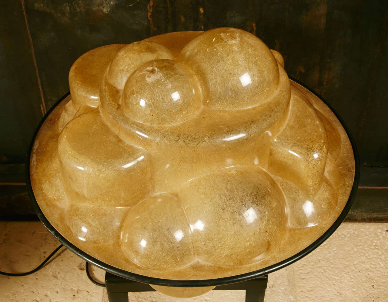 Profiterole lamp model 640 in translucent resin and glass fiber. Five bulbs. Black rubber belt.