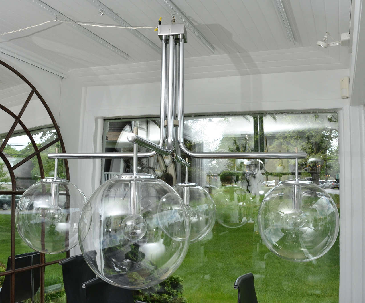 Chrome four-glass globe chandelier, takes standard bulb max wattage.