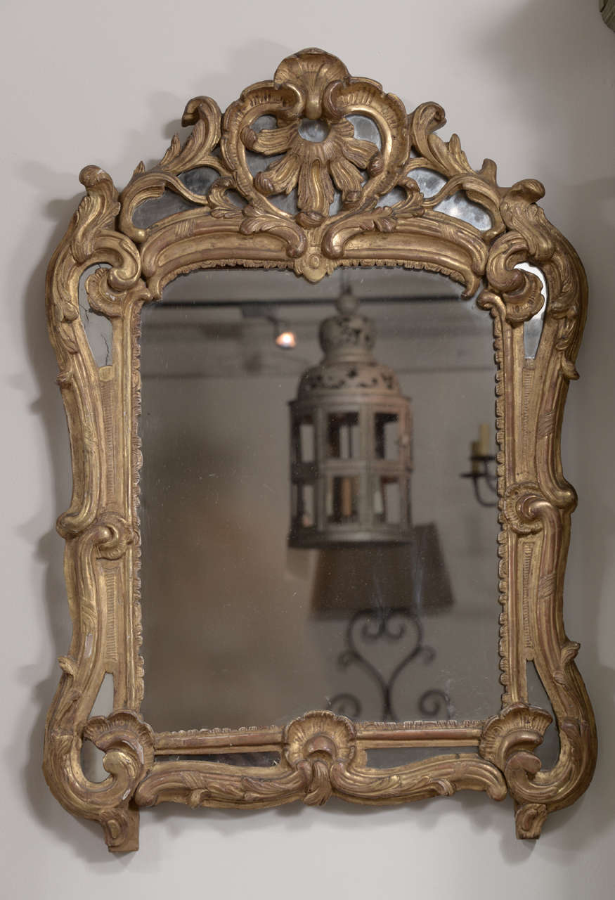Beautifully carved gilt wood  18 th. C Louis XV mirror in excellent condition.