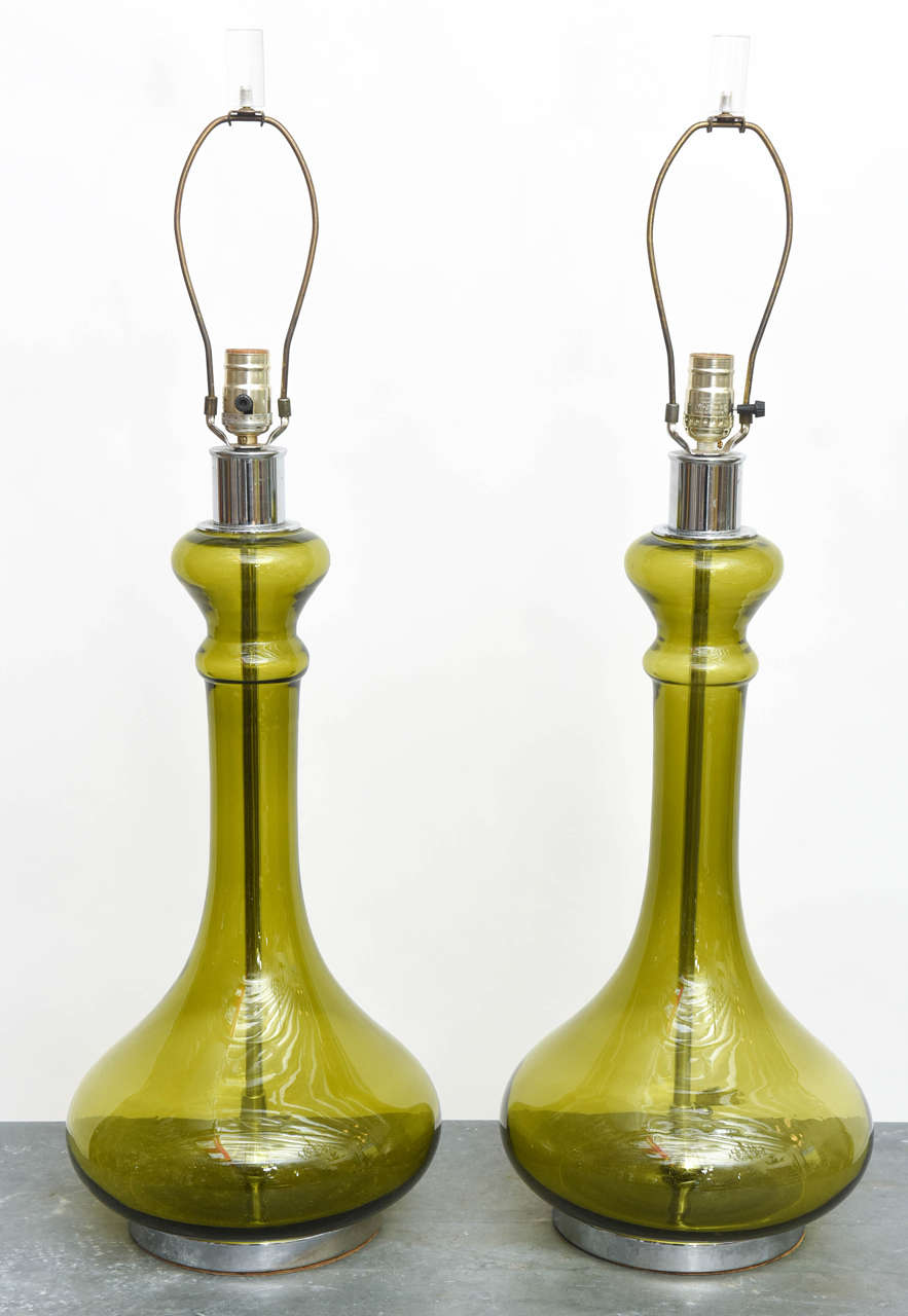 Great pair of avocado green mid-century glass lamps with chrome fittings and Lucite finials.
