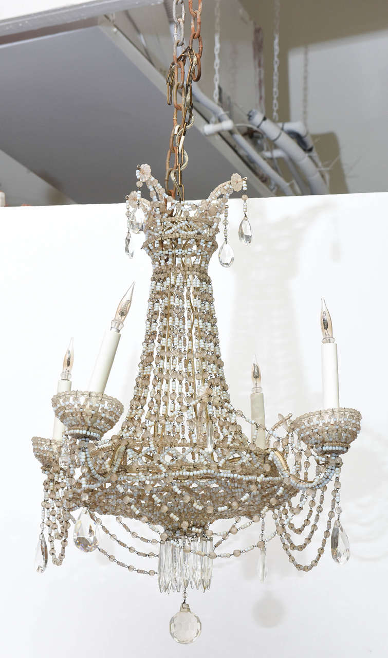 Exquisitely beaded petite French chandelier.