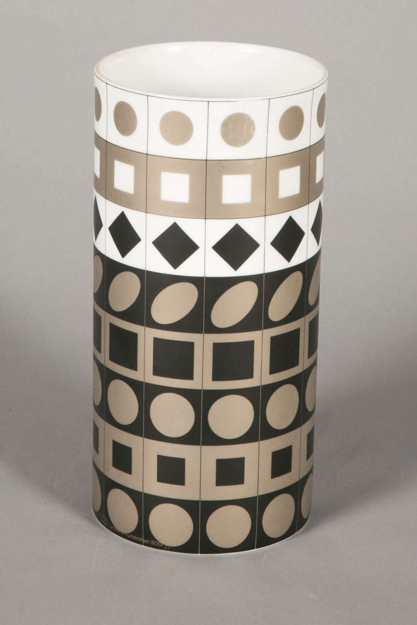 Porcelain cylinder vase by Vasarely for Rosenthal, Studio linie, circa 1970.
with white, silver-grey and black chess and geometrical designs.
Stamped.

Rosenthal, German luxuous porcelain manufacture, was created in 1879 in Selb (Bavaria). It is
