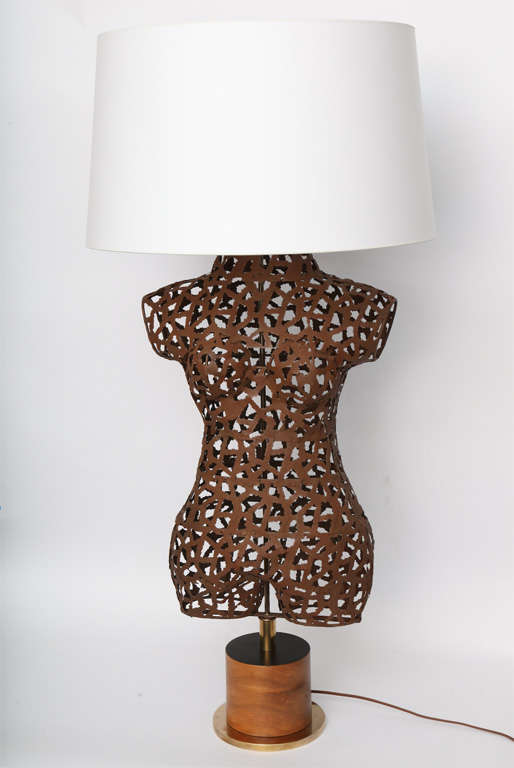 An Italian 1960s sculptural torso patinated metal table lamp.
Shade not included