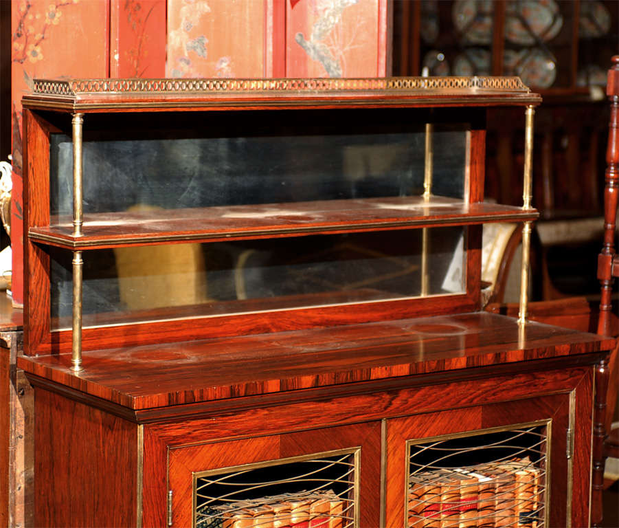 Regency style rosewood chiffoniere with brass gallery, shelf and cabinet below. 

For many more fine antiques, please visit our online gallery at: www.williamwordantiques.com. 

William Word Fine Antiques: Atlanta's source for antique interiors