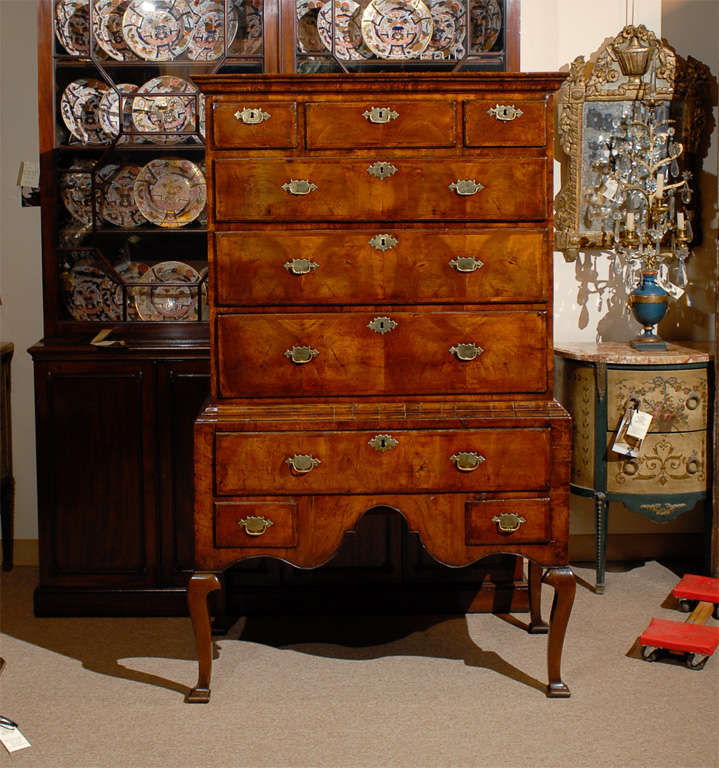 A fine Queen Anne highboy in walnut with moulded cornice, 9 sliding drawers and shaped apron. All resting on cabriole legs and unusual pad foot. 

For many more fine antiques, please visit our online gallery at: