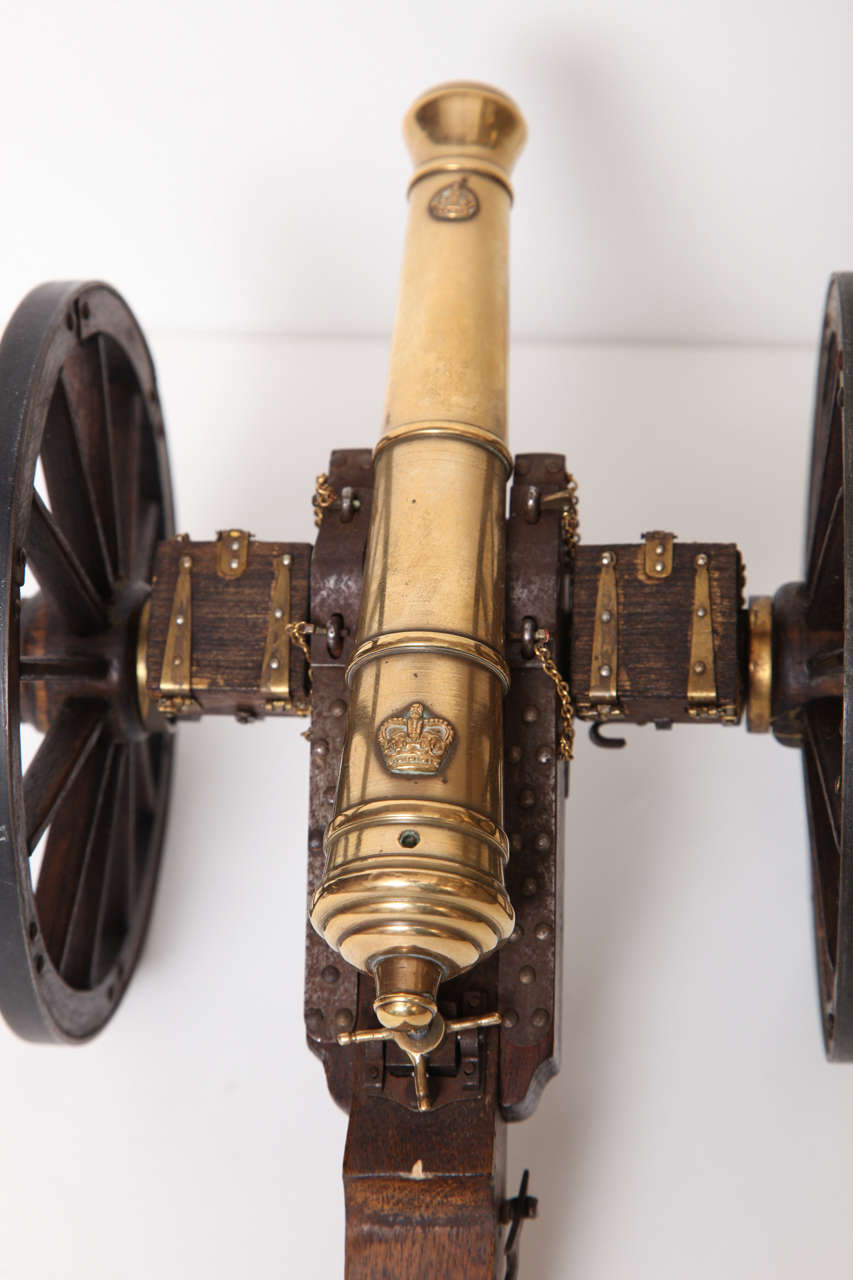 A Pair of Edwardian Mahogany and Brass Model Cannons 1