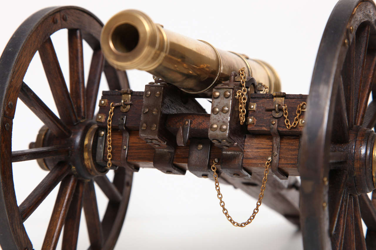 A Pair of Edwardian Mahogany and Brass Model Cannons 4
