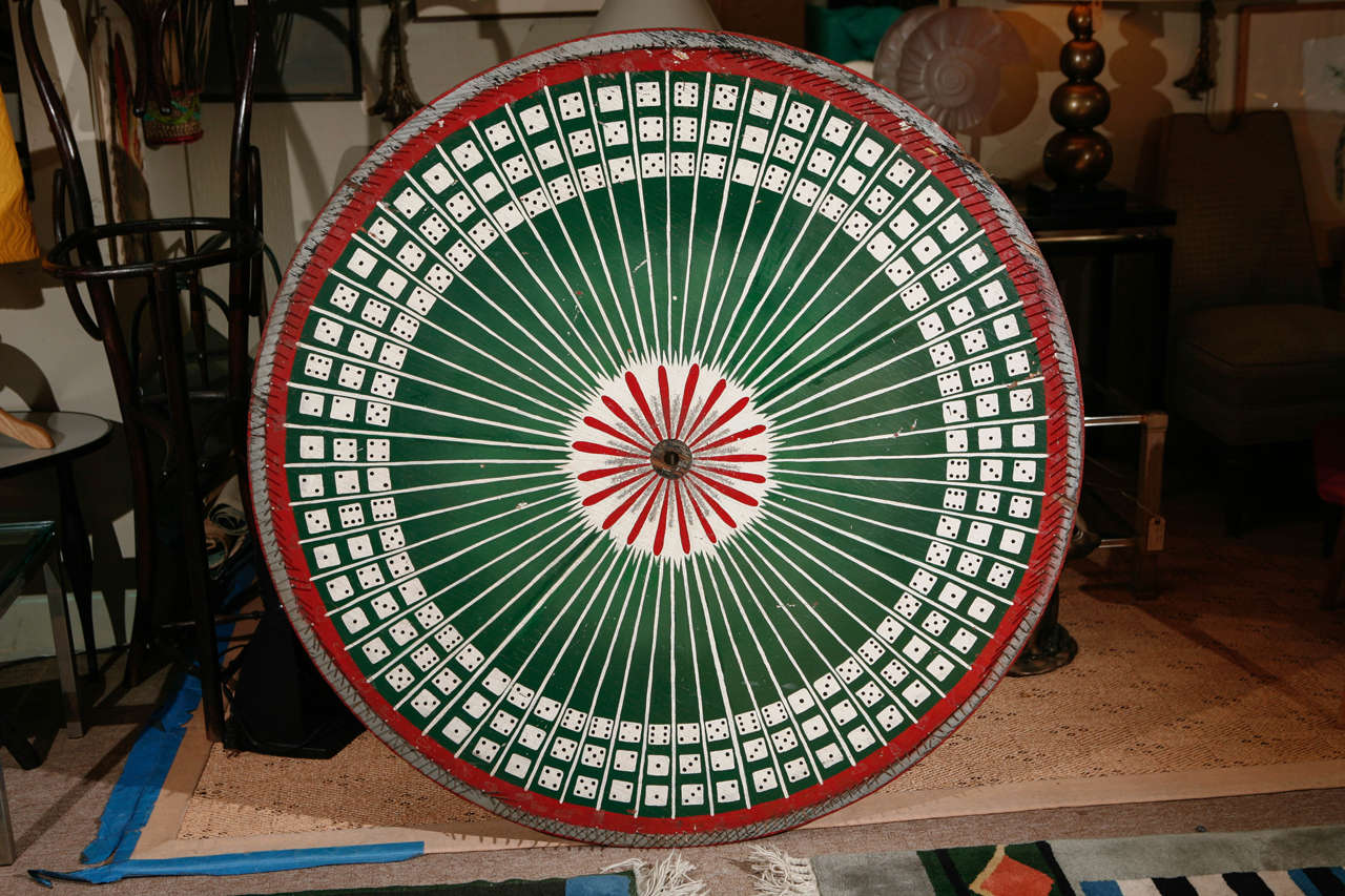 A wonderful vintage carnival gaming wheel from the 1920s. Original paint.