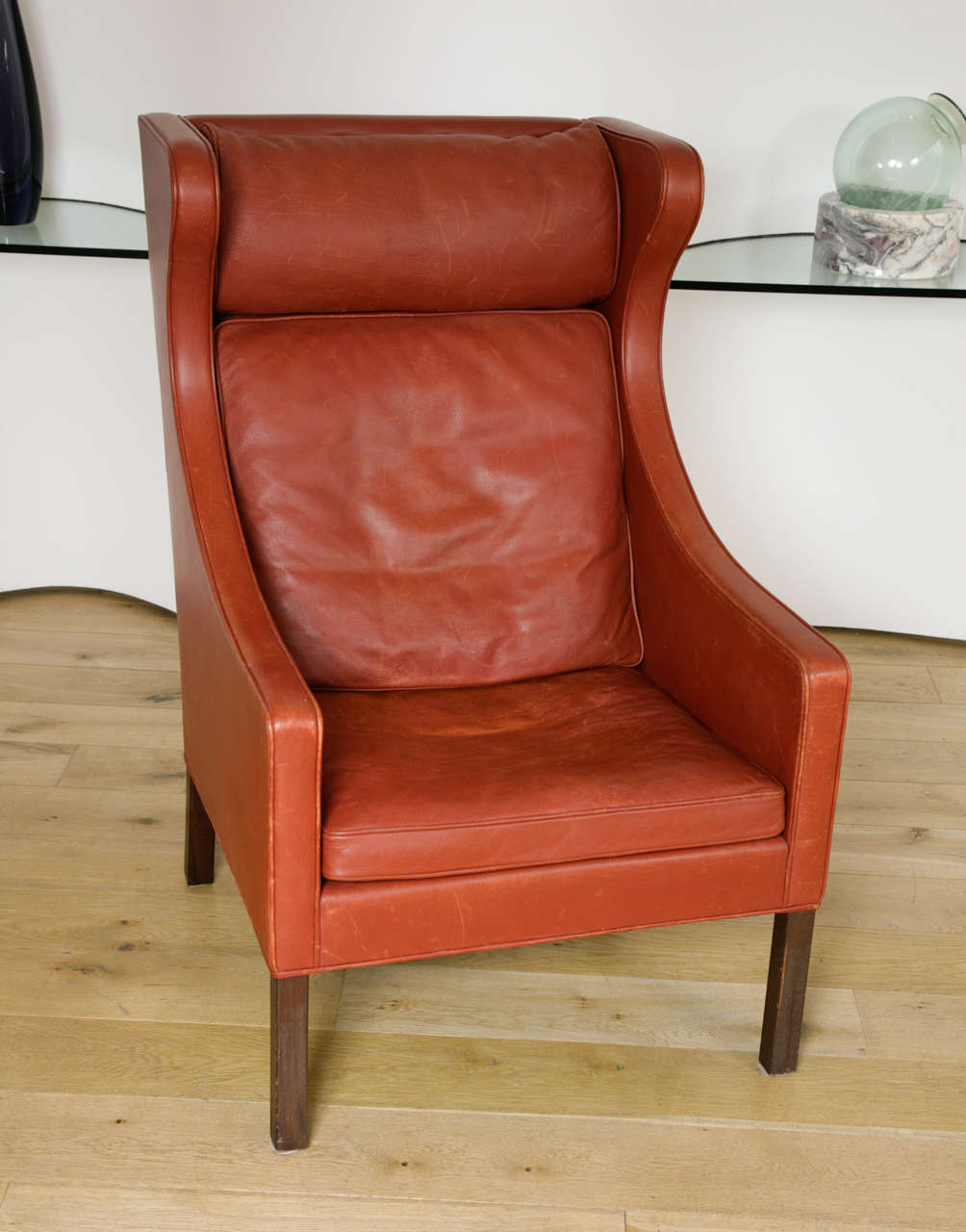 russet-coloured leather with teak legs