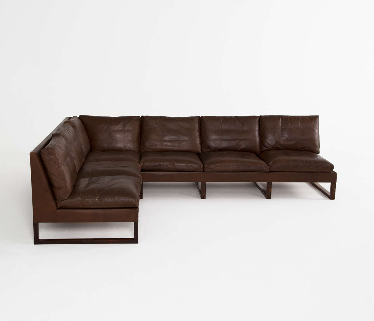 Cornersofa, leather and rosewood, Denmark 1960s. 

Very well conditioned sectional sofa in nice dark brown leather.
This 6-seather sofa consists of two elements, combined as a corner sofa model. 

The condition of this sectional sofa is superb.