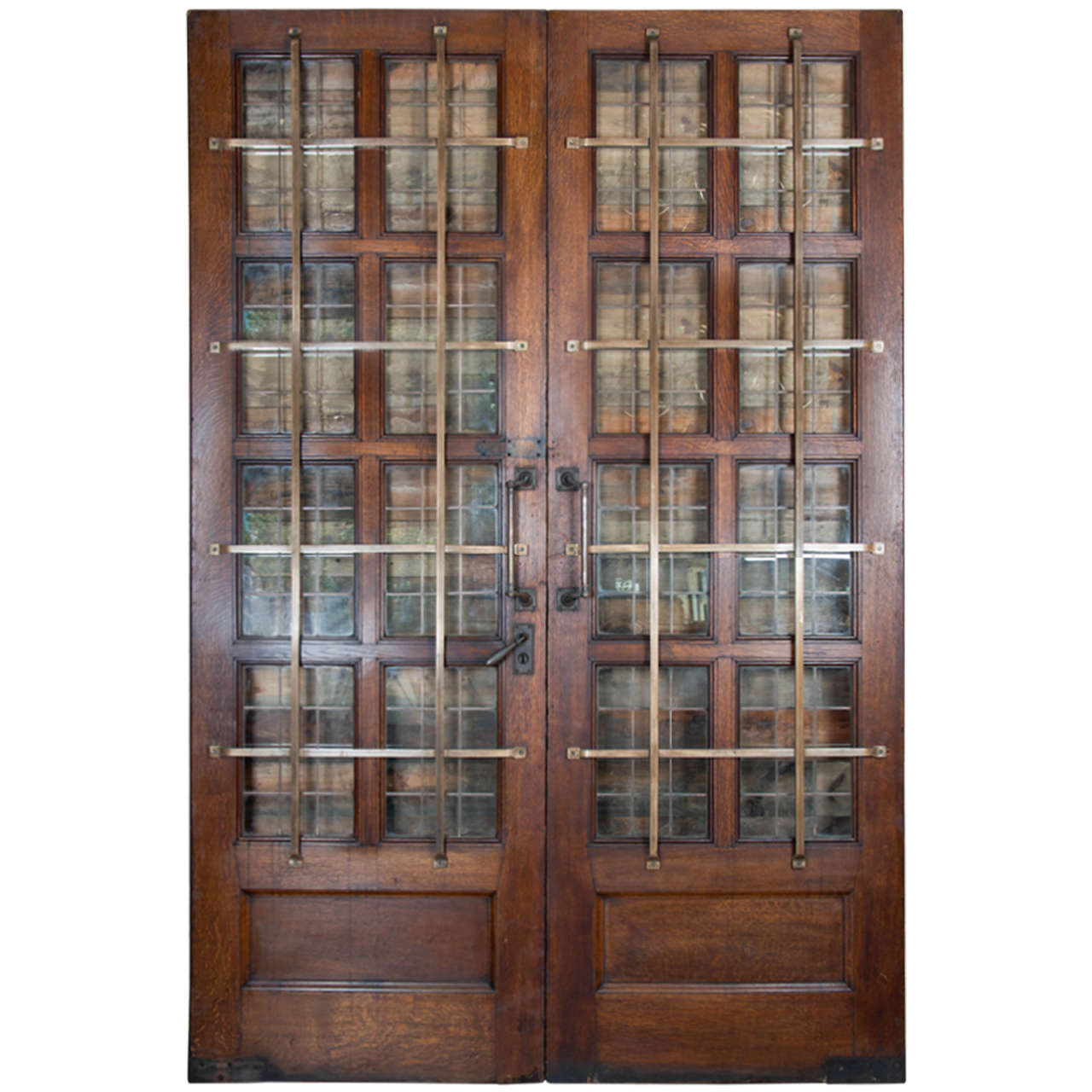 A superb pair of solid oak double doors removed from a church in Kensington, West London. 

These impressive double doors are of exceptional quality and have been restored to a very good standard. The doors each have eight copper glazed panes with