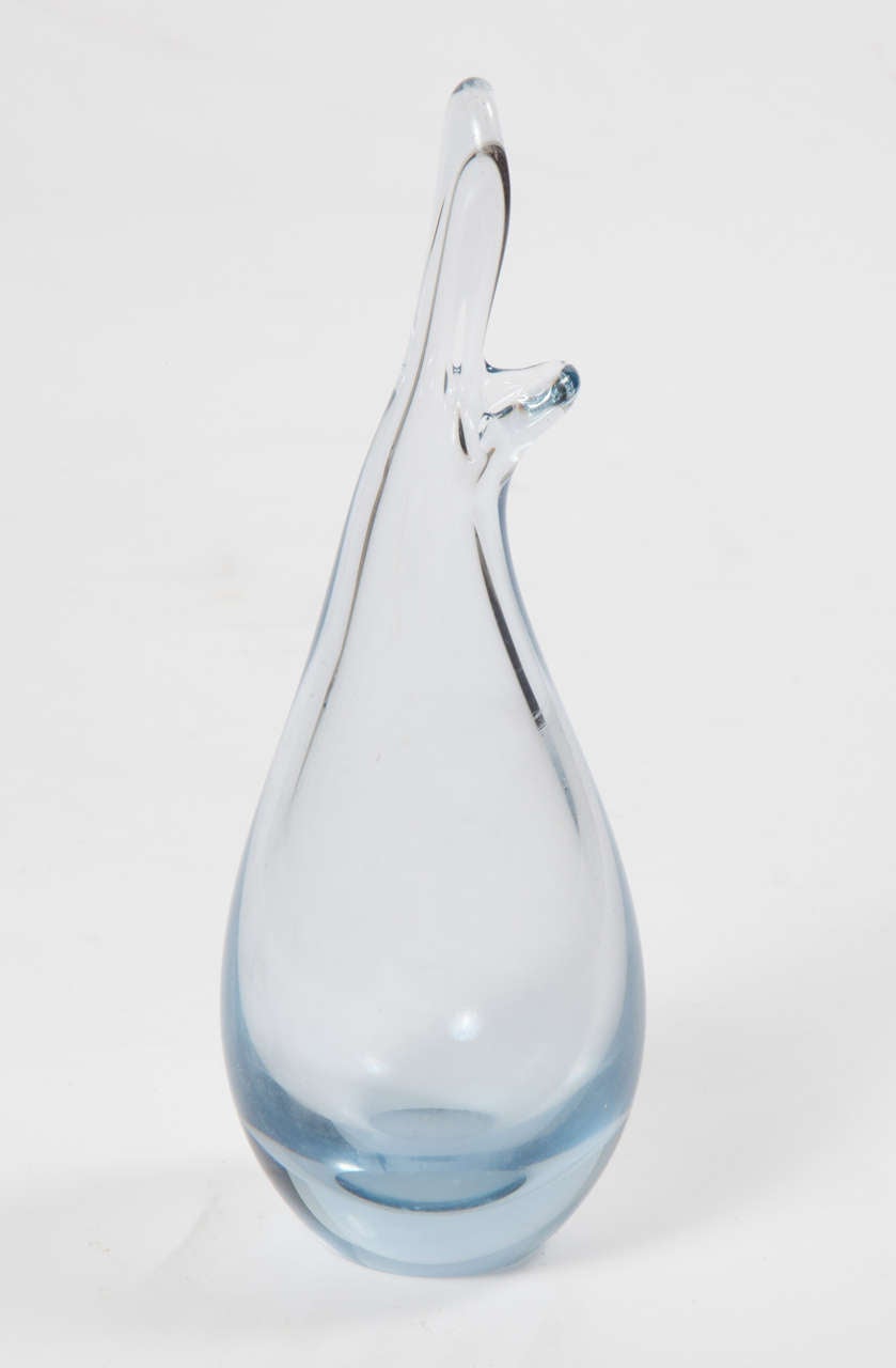 Vintage 1950s Holmegaard Bud Vase by Per Lutken

This Blown Glass Vase is an unusual Holmegaard vase designed by Per Lutken. The form is based on rose water sprinklers made in Persia in the middle ages. This example is in light blue-colored glass.