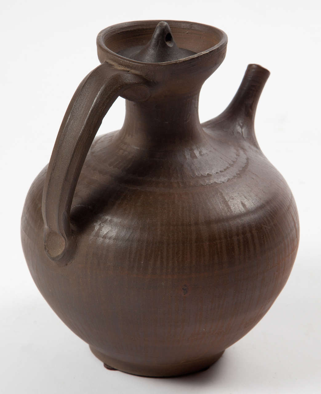 Vintage 1950s Danish pitcher

This handmade ceramic kettle is in excellent condition. I think it's more of a decorative piece, but a beautiful one that will put that final touch on your ceramic collection. Ready for pick up, shipping, or delivery.