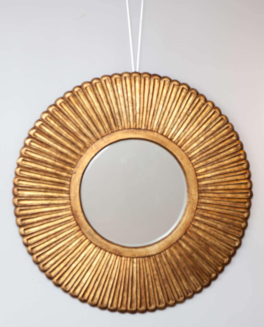 A Pair of gilt wood sunbursts or daisy mirrors with beveled glass, France, Ca. 1970