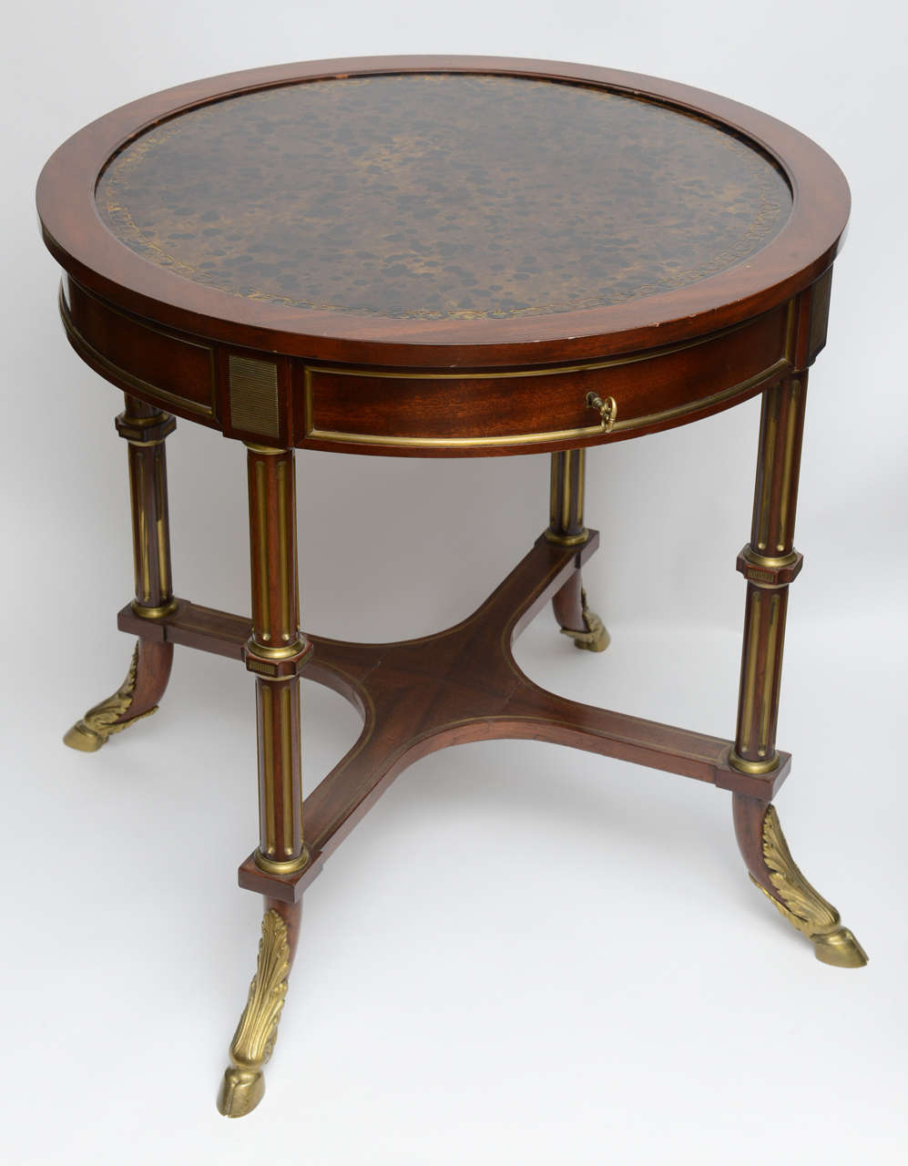Most unusual & unique table which opens to a square card/ games table.  Manufactured by a small workshop in France that did a very limited number of high quality pieces.  Beautifully hand made of mahogany with very crisp ormolu mounts.  The tooled