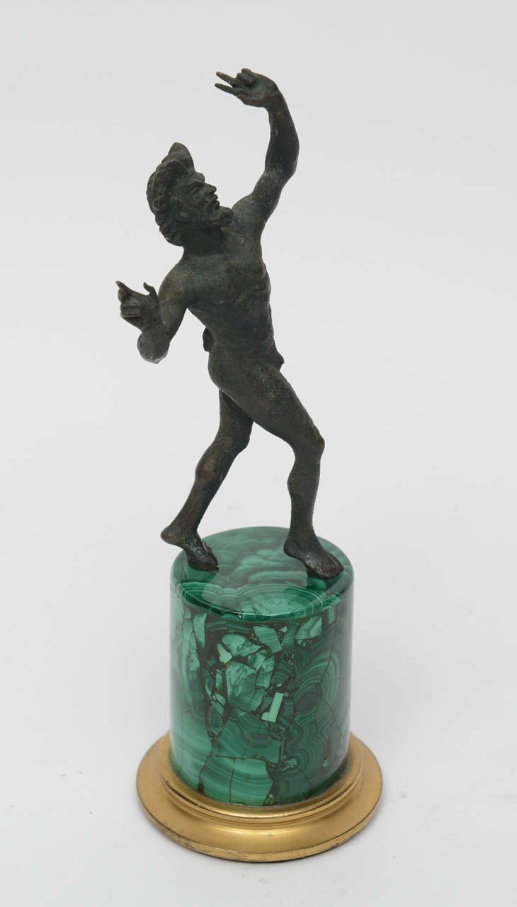 Well detailed bronze fawn on a more recent round column malachite base.  

The Grand Tour was the traditional trip of Europe undertaken by mainly upper-class European young men of means. The custom flourished from about 1660 until the advent of