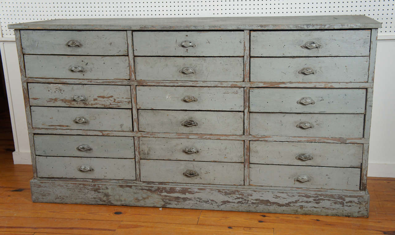 This worn , original painted dresser base has a soft grey color and metal pulls which are also original. Its clear that we, at Painted Porch are addicted to multi drawer pieces, particularly if they are useful and this piece certainly is. It is a