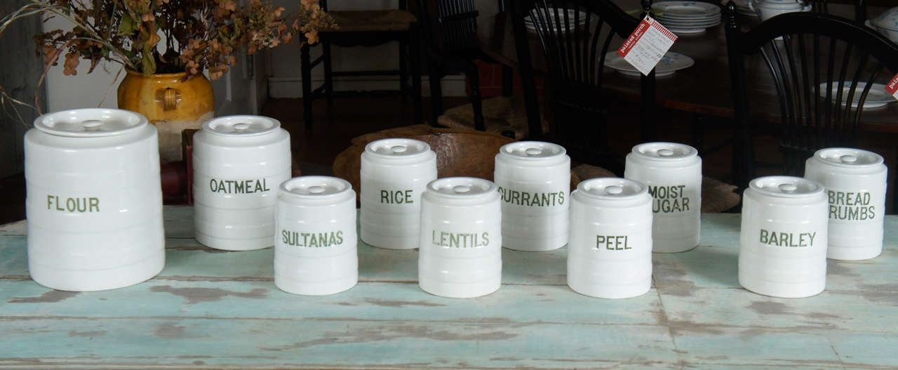 The maker is Grimwade and dates about 1910 with original writing on each jar. All have their lids. It is rare to have all the lids and this is a complete set for someone's kitchen. The color of the writing is a pale green. This set wont last
