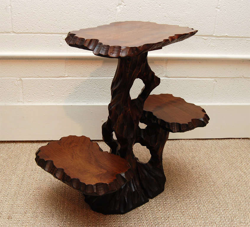 Here is a great Japanese root table with two tiered shelves.<br />
The carving detail and wood grain is beautiful and the custom walnut stain is rich.