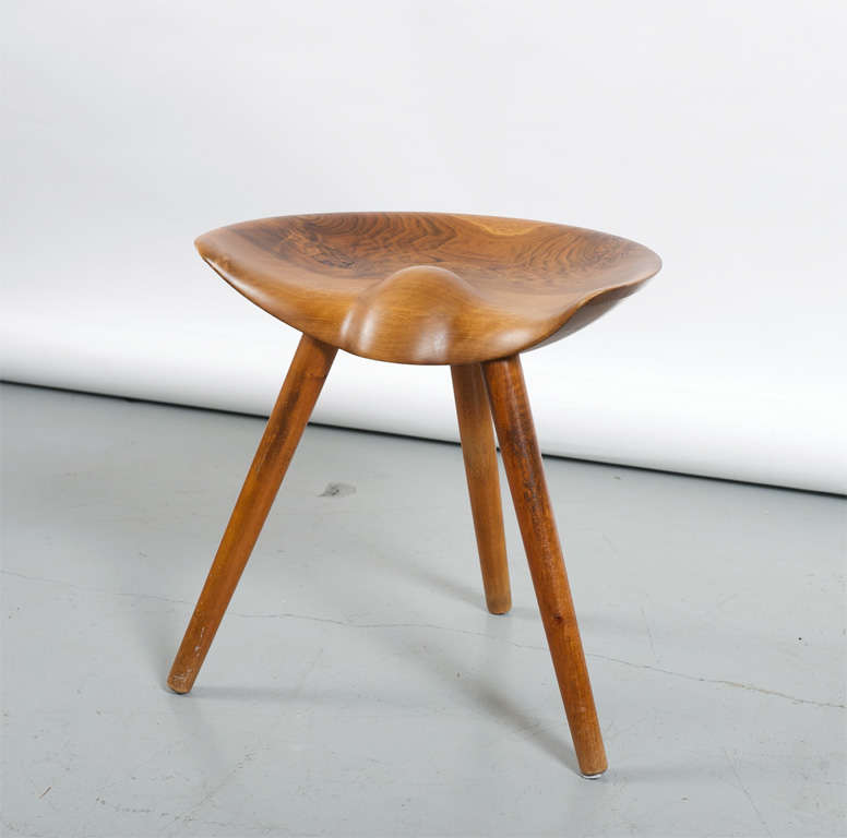 Walnut stool with semi-circular seat on three tapering round legs. Designed in 1942. Produced by Søborg Møbelfabrik. Literature: Noritsugu Oda, 'Danish Chairs', 1999, reproduced and discussed p. 51 and 'Dansk møbelkunst gennem 40 aar : Københavns