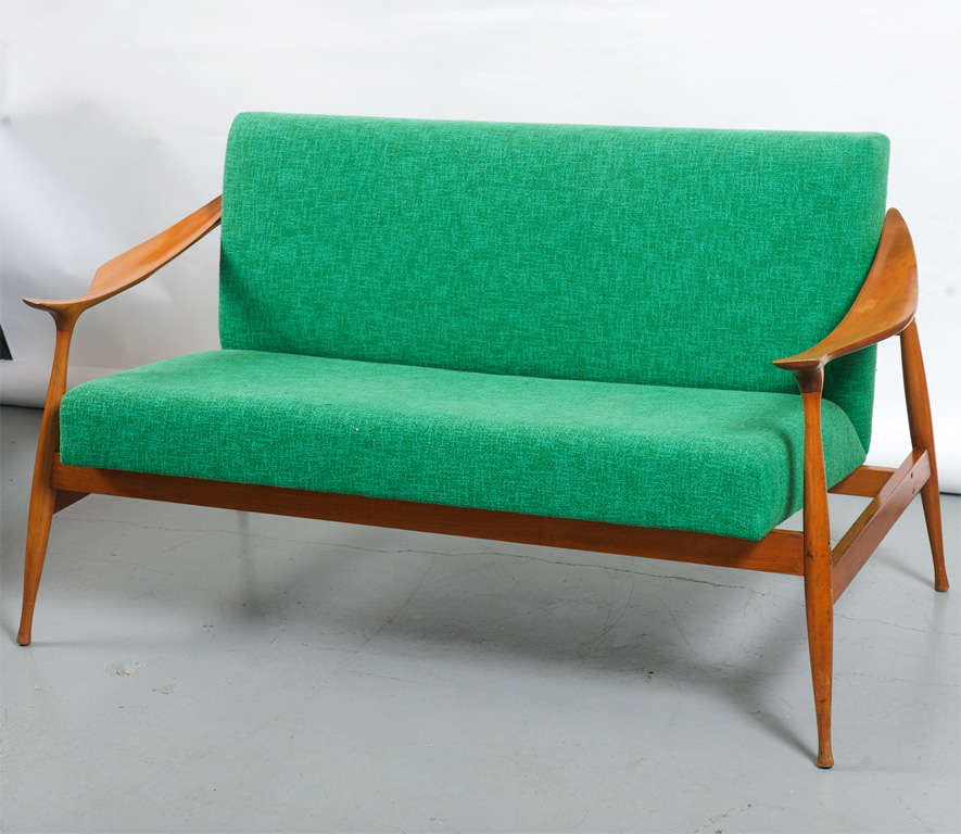 Italian settee framed of Walnut and green cotton upholstery.