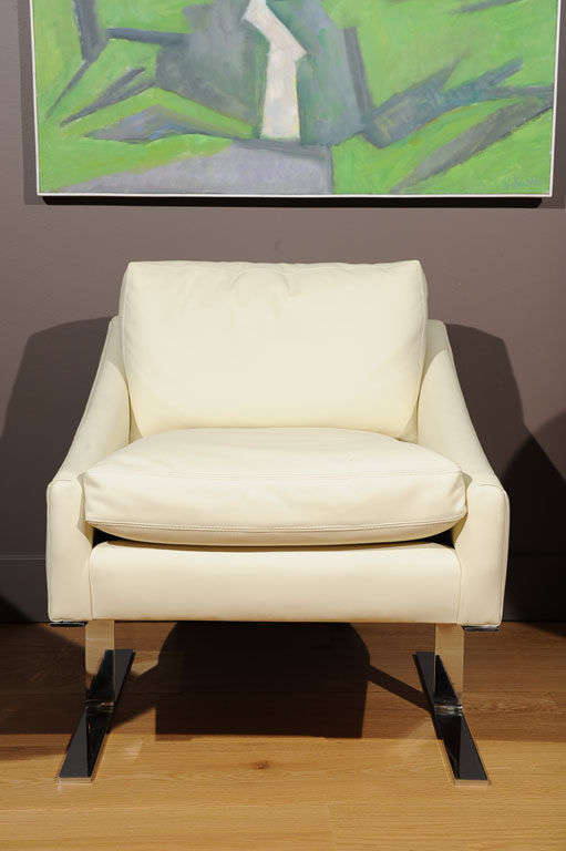 Kipp Stewart for DIRECTIONAL;  A lounge chair newly recovered in white leather with stainless steel legs; Unmarked.