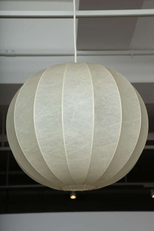 An early and original vintage sphere-shaped pendant light fixture by Achilles Castiglioni for Flos.  Italy, circa 1960. 

Made of parchment stretched over a metal frame.  See our other listings for other shapes.