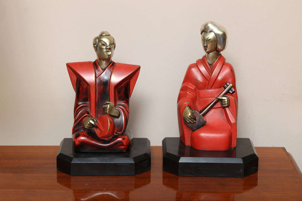 Pierre Ernest Bouret.
Silvered and lacquered bronze bookends, from circa 1928, signed and numbered. 

French sculptor Pierre Ernest Bouret (1897-1972) was a member of the Salon des Tuileries, member of the Salon d'Automne, a professor at the