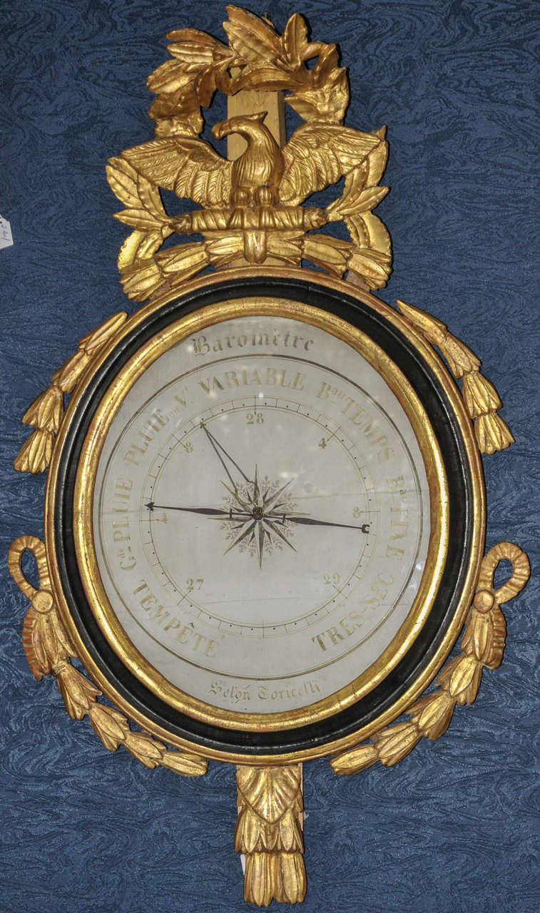 18th century Louis XVI period barometer in gilded wood and glass; identified as being 