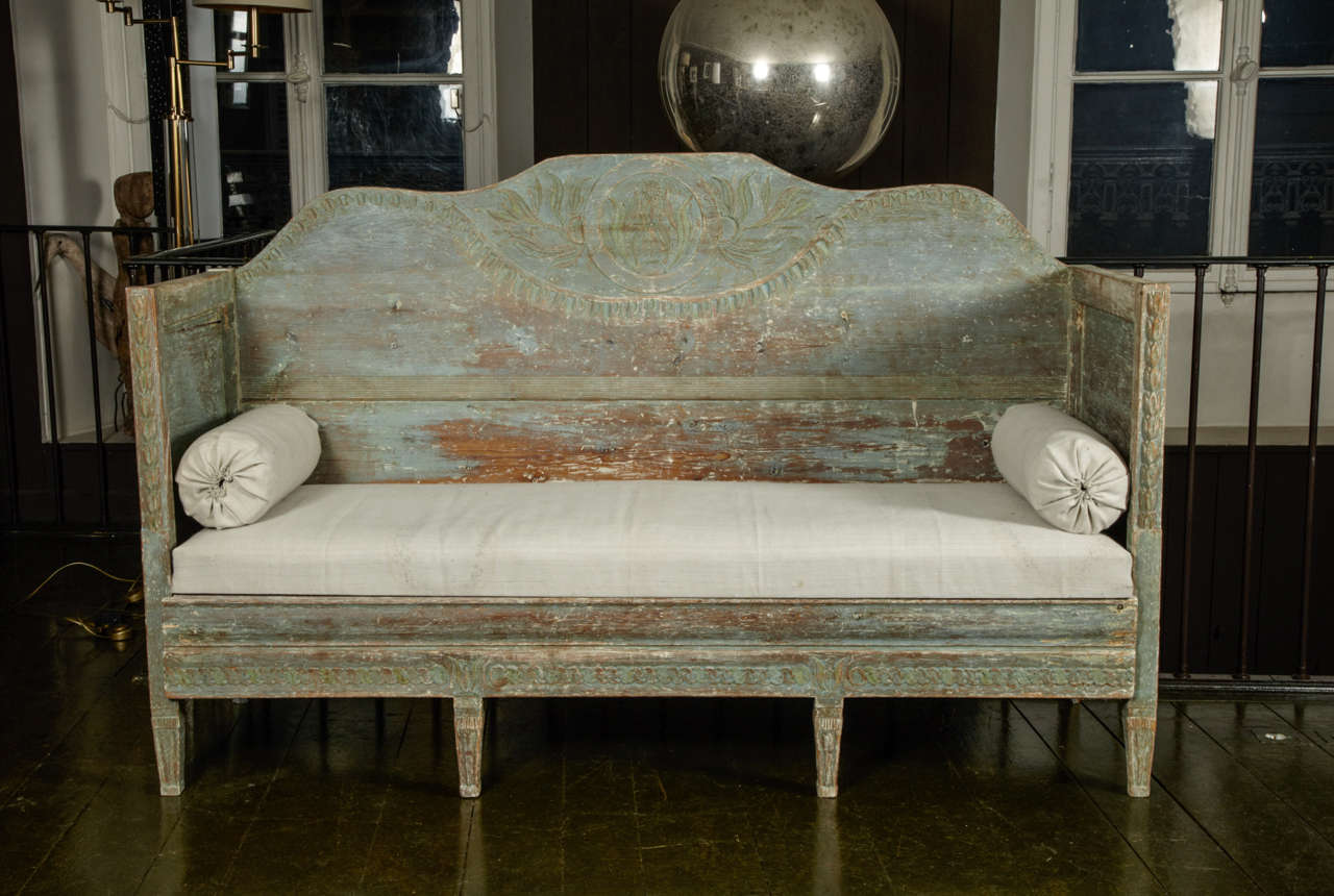 Very nice Swedish  gustavian sofa from the 19th century in faded blue paint of origin.
The sofa itself features many high Gustavian details such as the guilloche frieze and the leaves carved on the legs and columns.