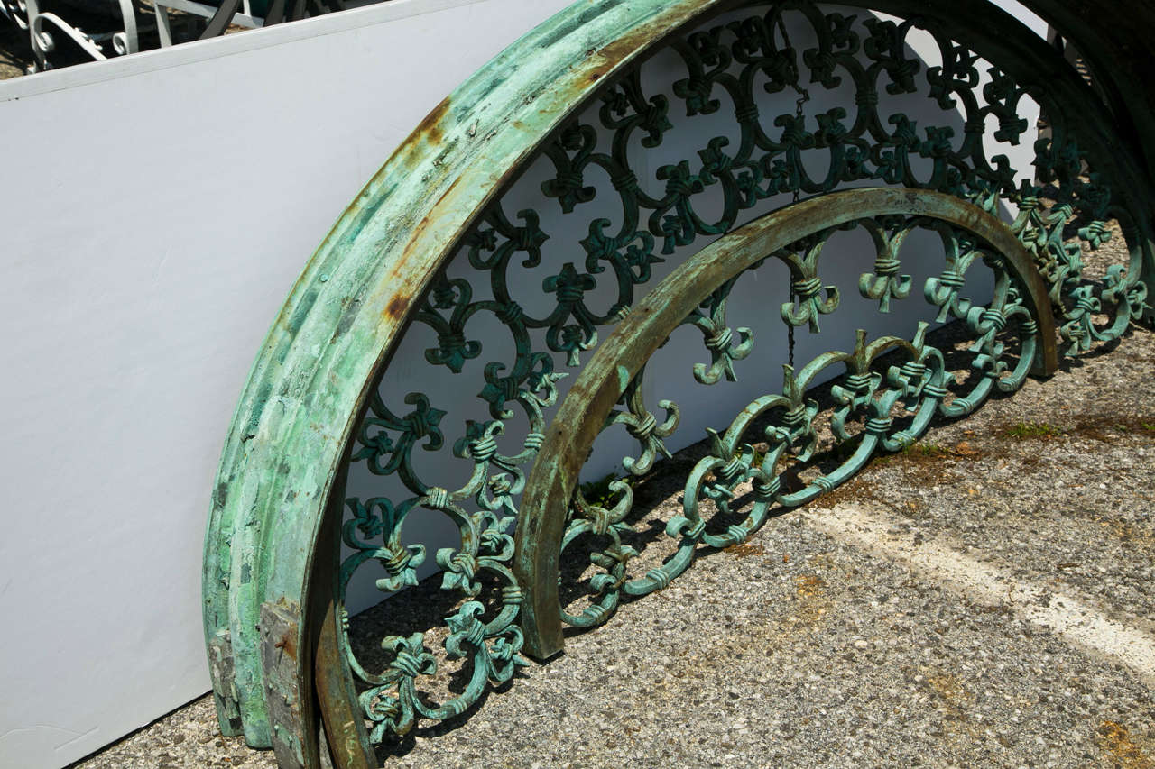 This turn of the century bronze arch has a beautiful patina.  It would be great to use as an architectural design entryway, structural element,  or even as a headboard to bed. This solid bronze arch has a fabulous pattern in fleur de fleur design.