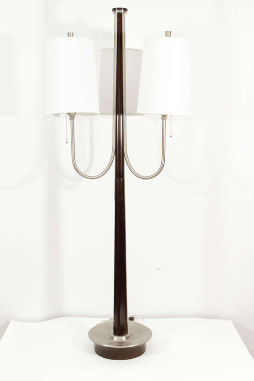 Exceptional three-arm large table or medium sized floor lamp in walnut and satin nickel, in the style of Tommi Parzinger.