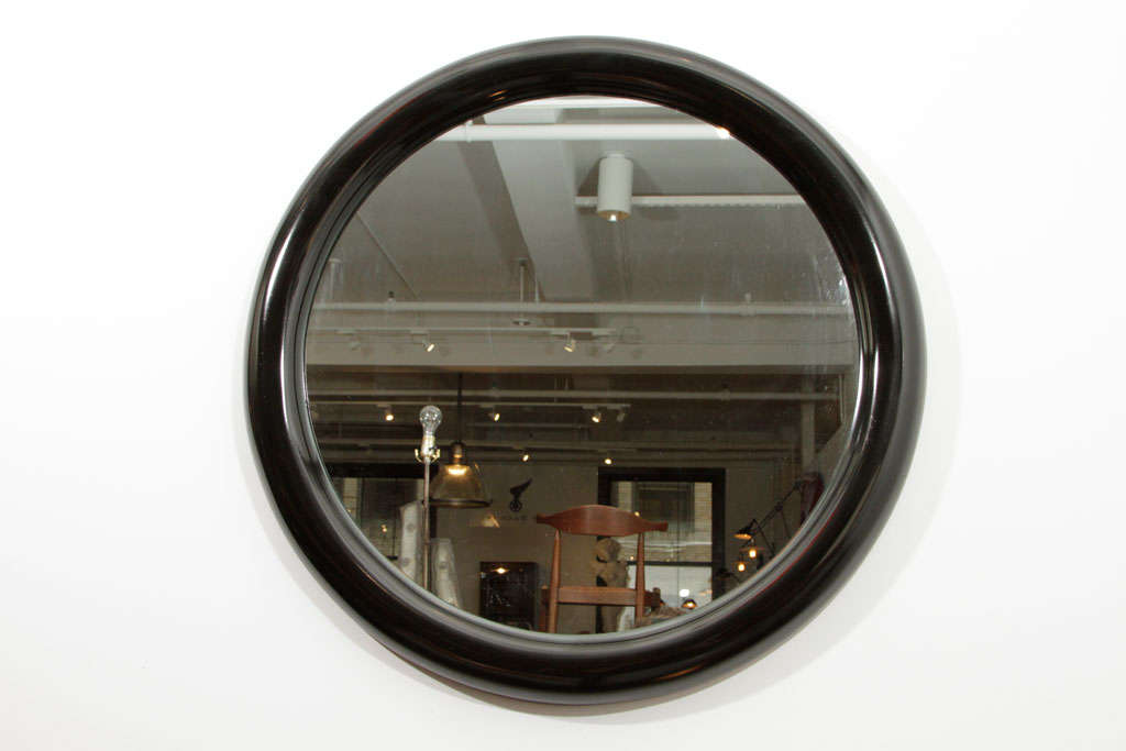 Round mirror with deep bullnose frame in the style of Karl Springer.  Designed and made by Marcius for Casa Bique.  USA, 1984.<br />
<br />
Marcius's designs debuted in 1974 and were distributed by a range of retailers, including Karl Springer