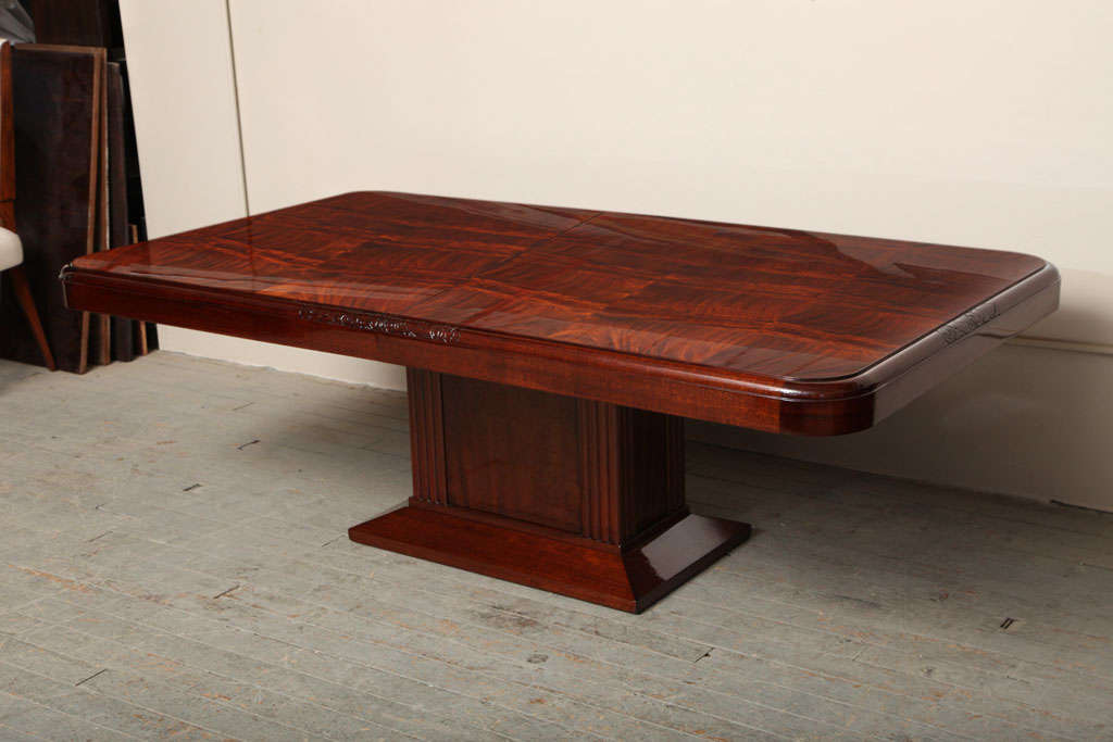 Elegant Art Deco Pedestal Dining Table. Mahogany with Cuban flame mahogany top. It has 3 each 30