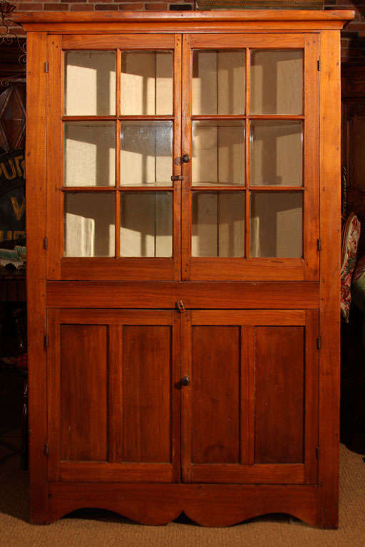 American Walnut Corner Cupboard with Two Glazed (glass) Doors

This is a sweet Pennsylvania Dutch corner cupboard in solid Walnut.  It is completely original including the front and back. 

It features hand-made crown moulding, two glazed doors