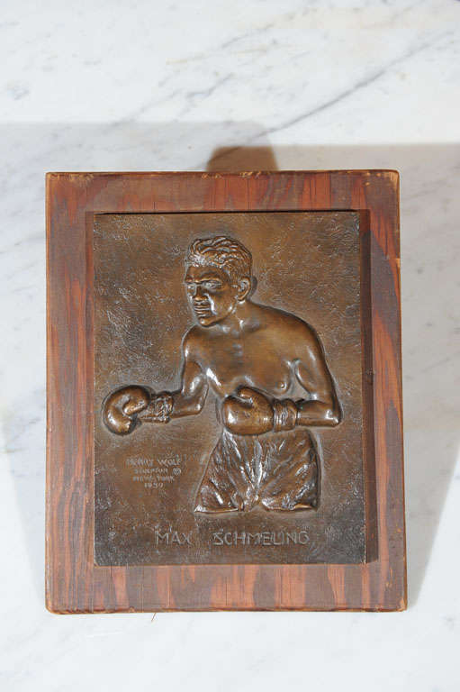 A very nice example of a great sports collectible and American sculpture. This bronze plaque captures the essence of the well known German heavyweight champion, Max Schmeling. It is artist signed, Henry Wolf N.Y. 1930. Schmeling was one of the very