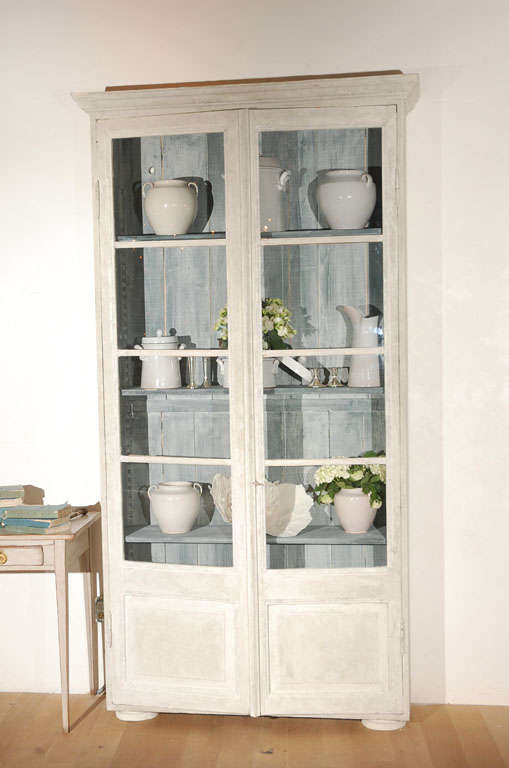 Fantastic French display cabinet with chalky blue gray interior.