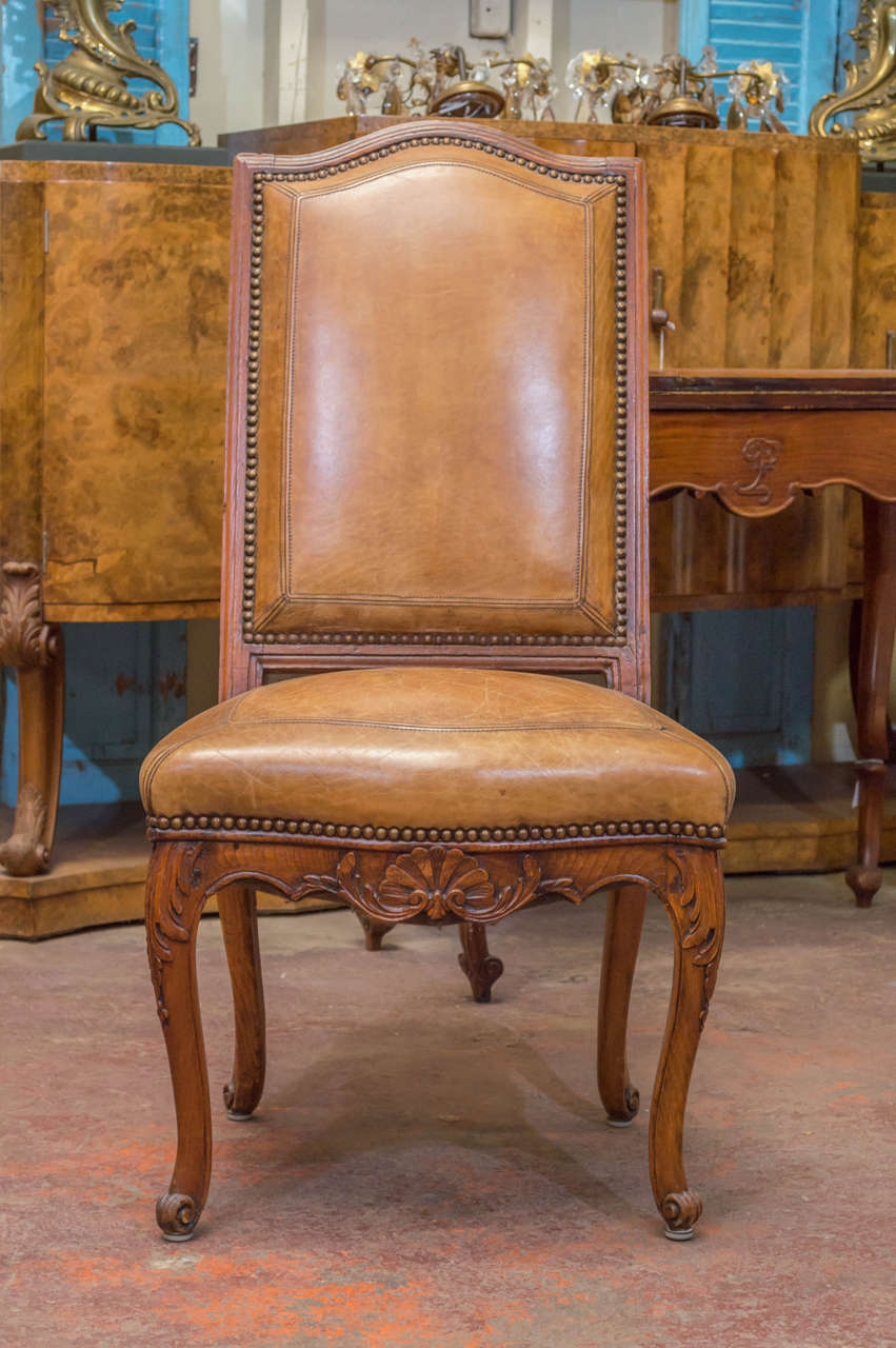 Pair of early 19th century French chairs upholstered in leather.