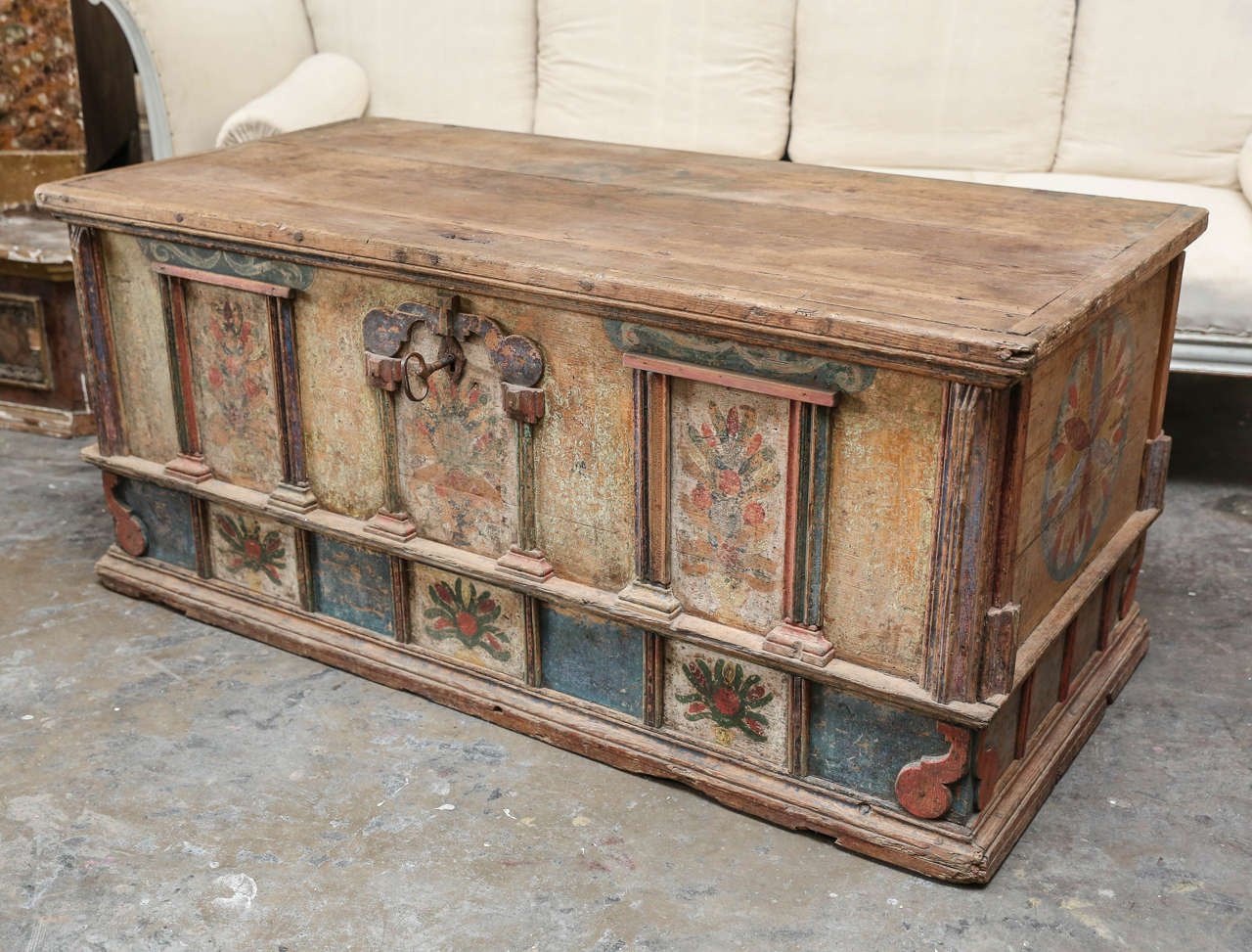 This whimsical 18th century Italian Folk Art trunk features beautifully painted designs in various colors that have faded over time. Its grandiose size would make a great edition to any home.