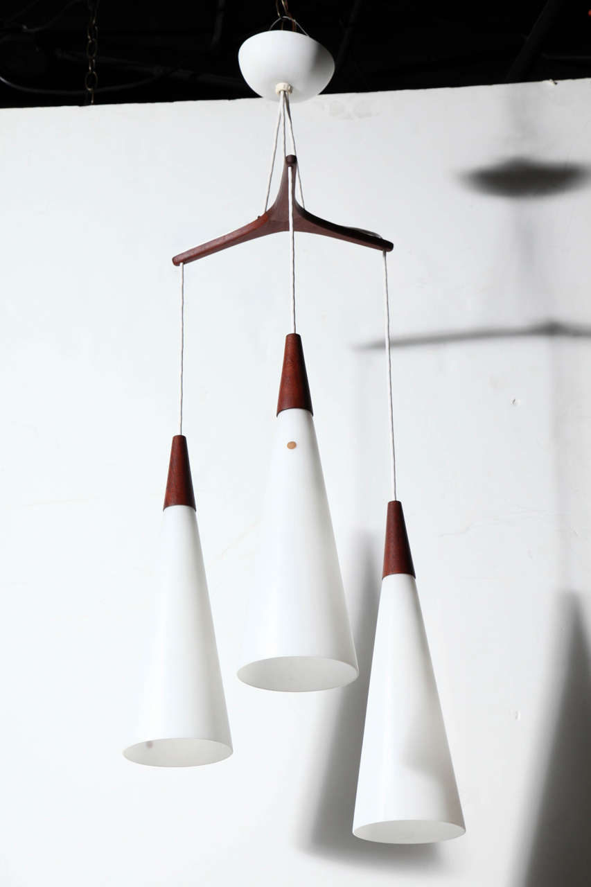 Scandinavian Modern Pair Holmegaard Glasvaerk Triple Hanging Pendants in White Glass & Teak, 1950s