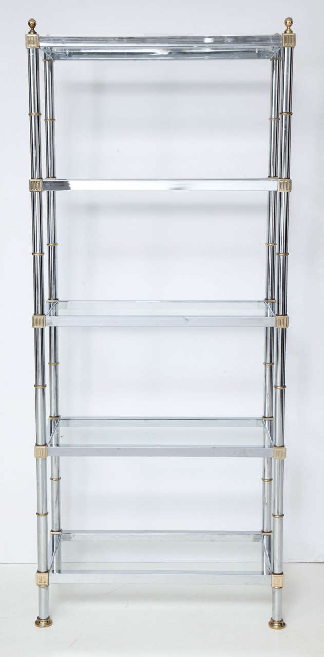 A chic and versatile five-shelf ètagerè with handsome detailing at corners and round finials on top.