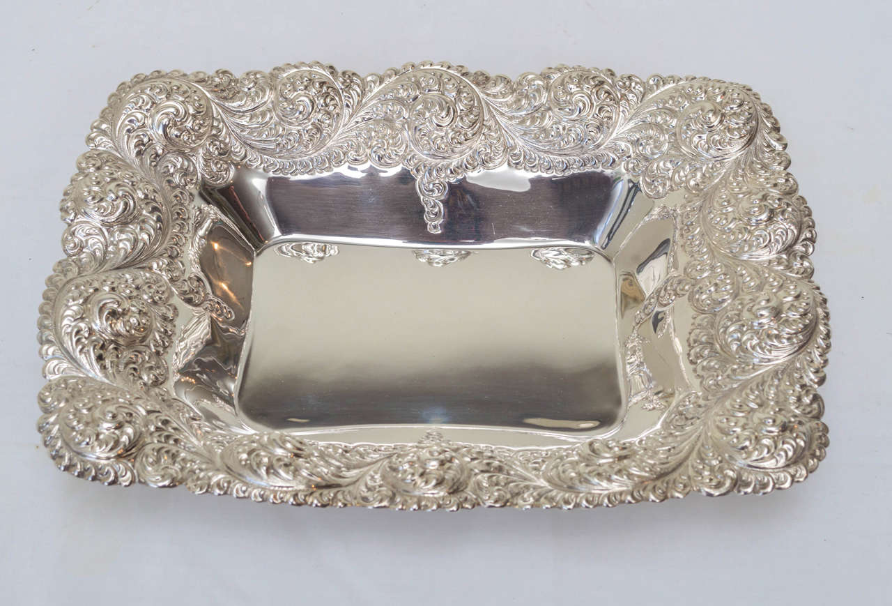 American sterling silver repousse bread basket. Deep paisley pattern repousse design. Marked with the Gorham hallmark and 248M.