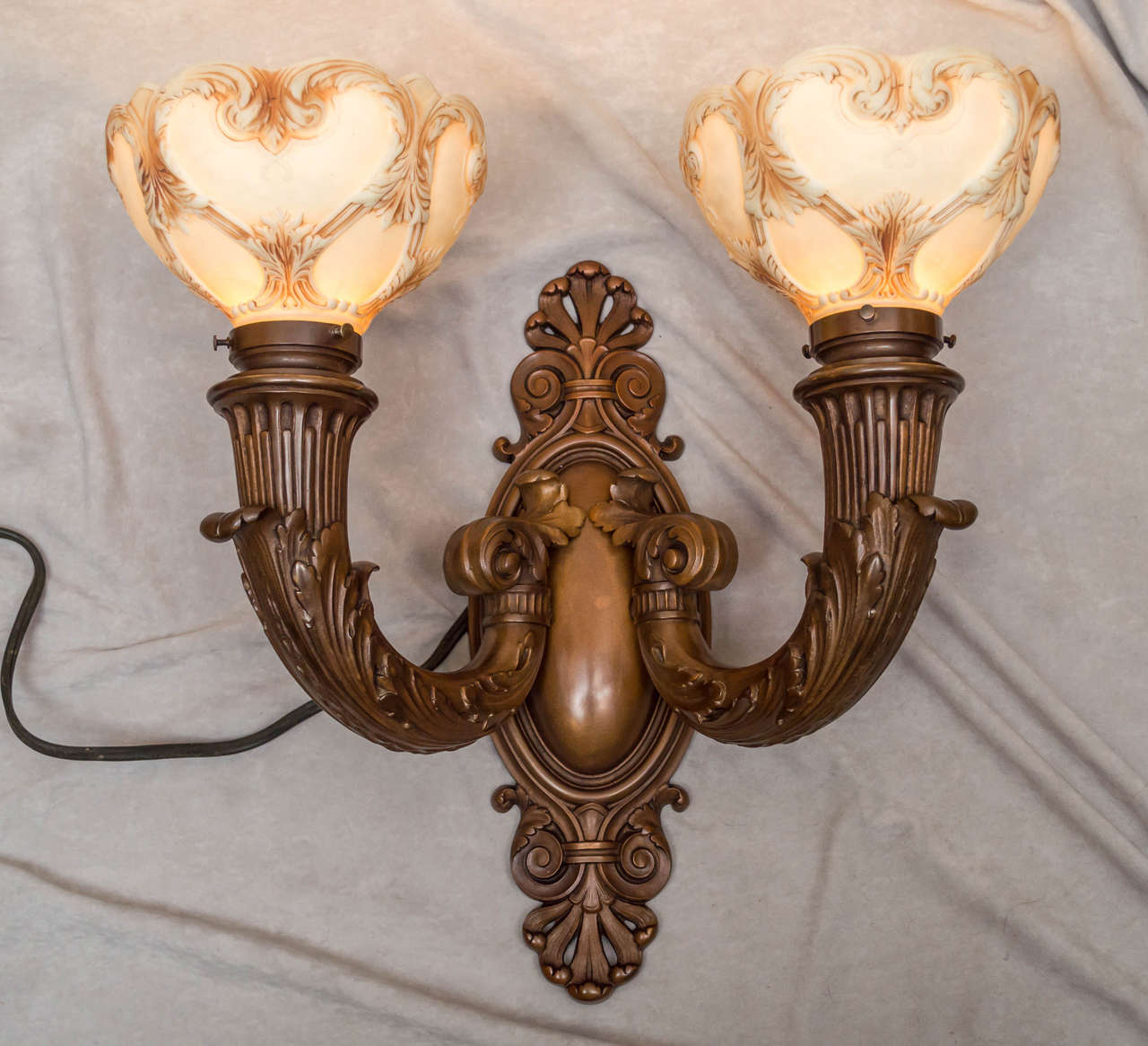 This massive and handsome pair of sconces represent the best of what a good foundry can produce. They are signed 