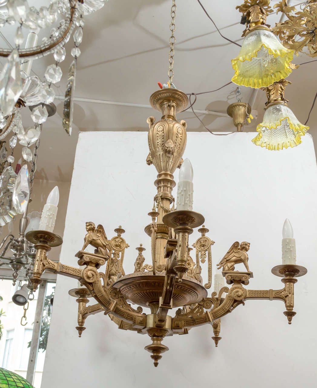This superbly cast gilt bronze chandelier offers the best of the desirable Egyptian Revival elements. Newly wired and ready to hang. Certainly one of our finest pieces of antique lighting.