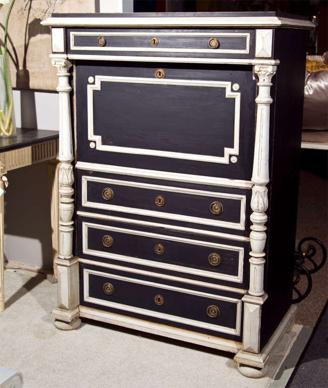 A charming Swedish Gustavian style secretaire a abattant, late 19th-early 20th century, overall black and white distress-painted, the molded top over a narrow drawer, atop a drop-front panel opens to a writing surface and storage drawers, supported
