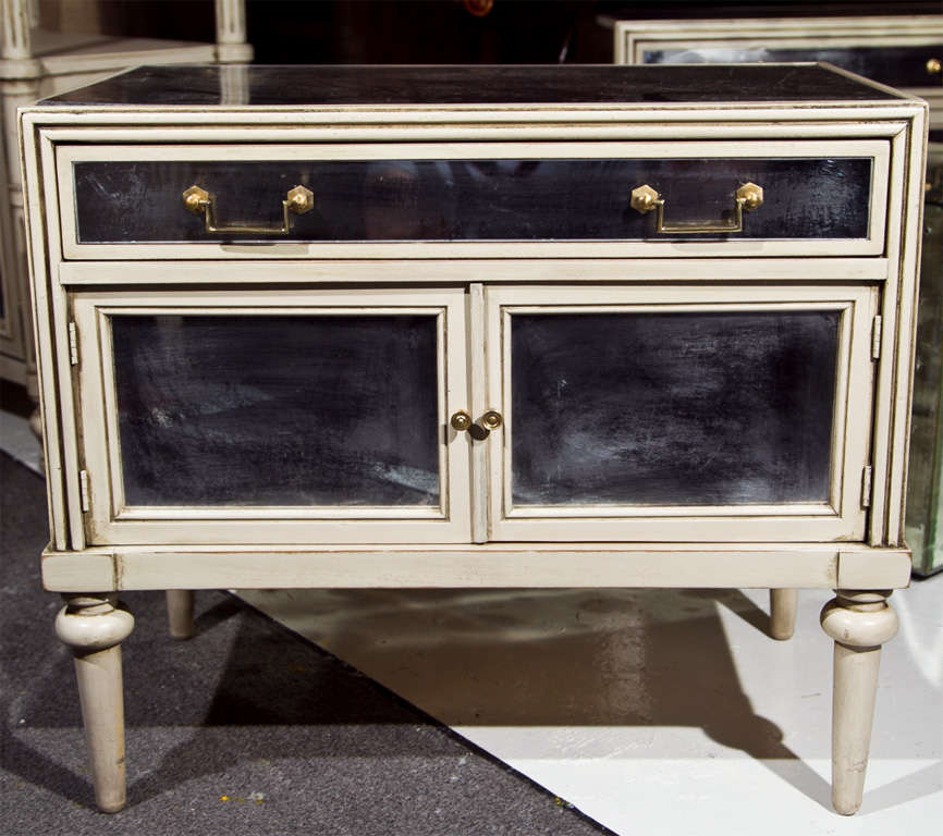 A PAIR OF OAK LINED SWEDISH PAINT DECORATED END TABLES - NIGHT STANDS. BOTH WITH MYLAR PANELS FRAMED. SINGLE DRAWERS ABOVE A CONFORMING DOUBLE DOOR BASE ON TAPERING LEGS.